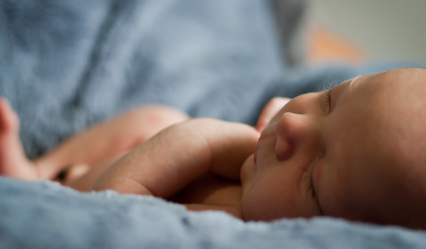 a close up of a person lying on a bed